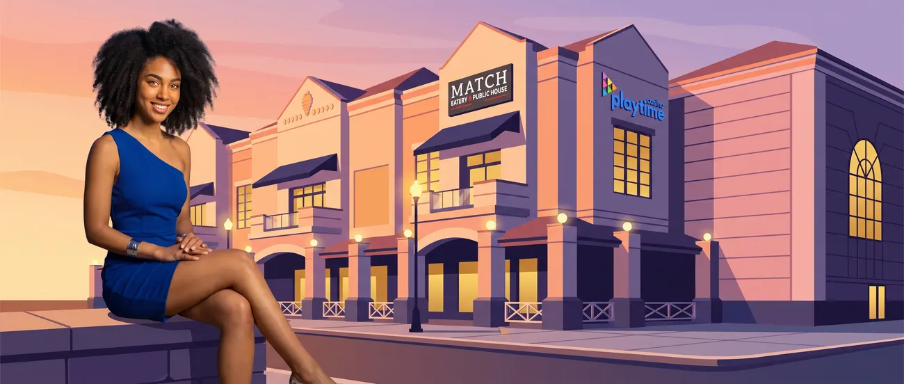 Woman in a blue dress across from the casino at dusk